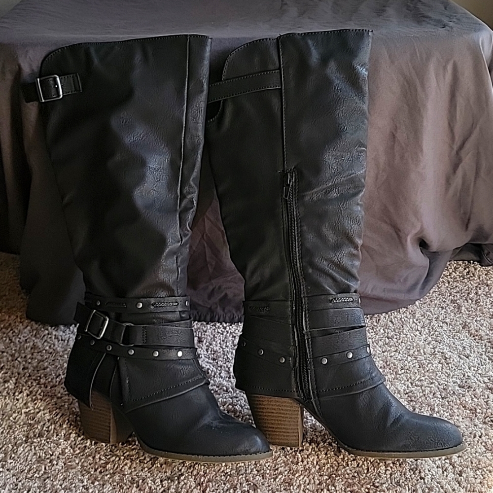 Below the knee Black Boots with 1 1/2 inch heel.